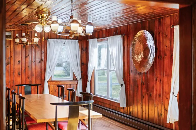 a view of a room with furniture window and wooden floor