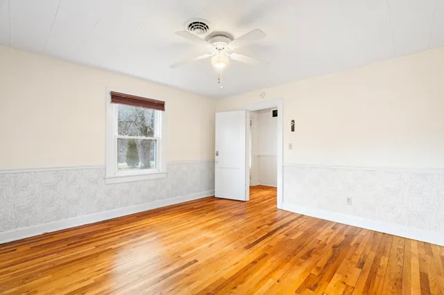 a view of a room with window and wooden floor
