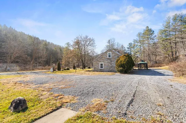 a view of large house with a yard