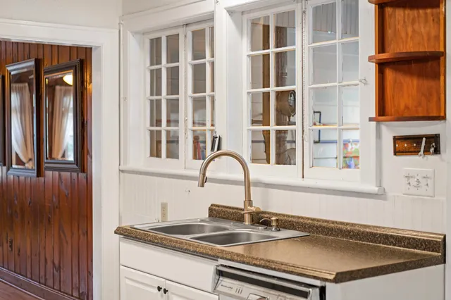 a kitchen with a sink and a window