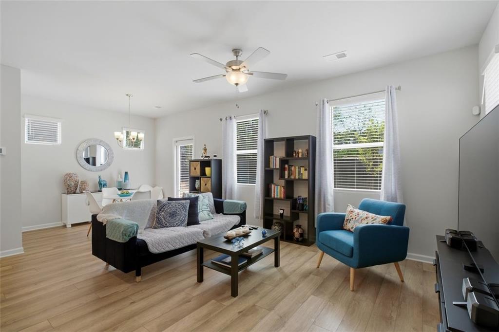1242 Riverstone Road Jonesboro, GA 30238 - Photo 13 of 38 a living room with furniture rug and window