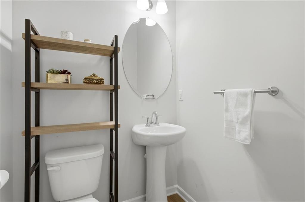 1242 Riverstone Road Jonesboro, GA 30238 - Photo 18 of 38 a bathroom with a sink and a mirror