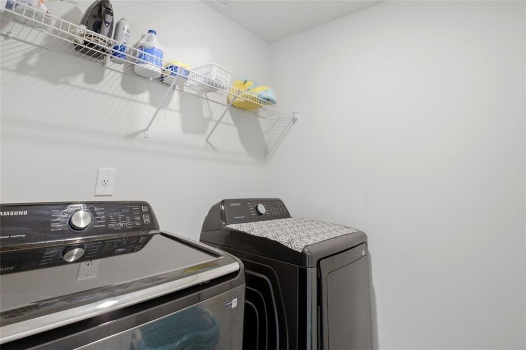1242 Riverstone Road Jonesboro, GA 30238 - Photo 20 of 38 a utility room with dryer and washer