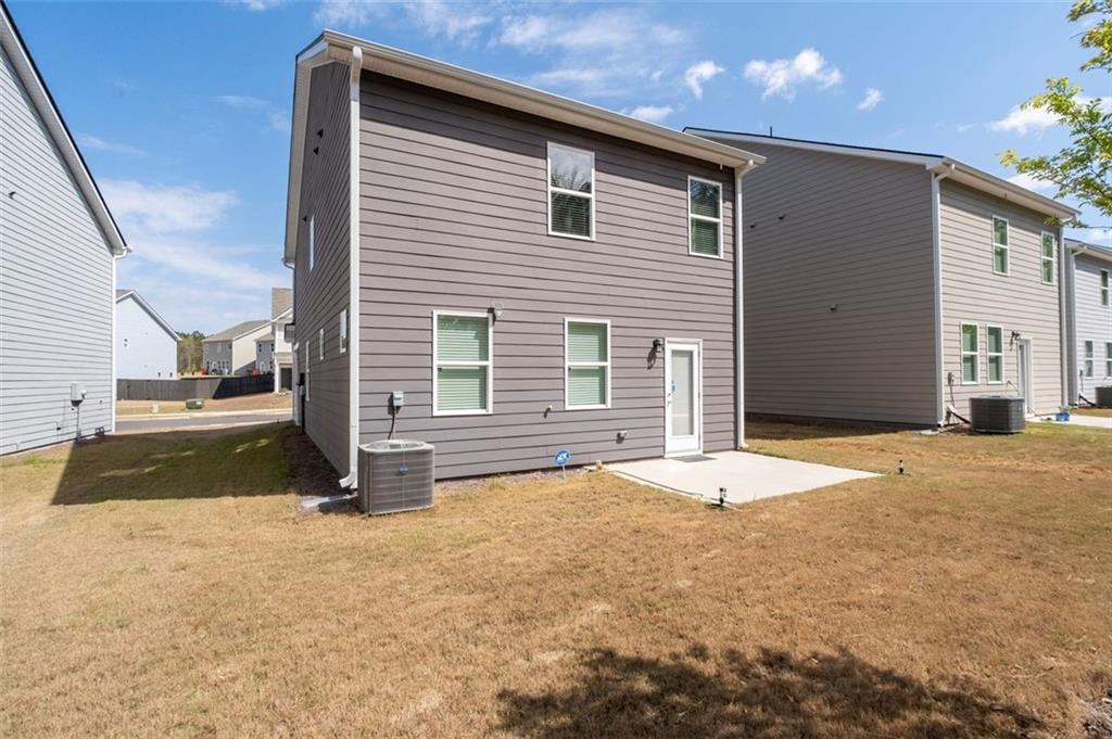 1242 Riverstone Road Jonesboro, GA 30238 - Photo 32 of 38 a front view of a house with a yard
