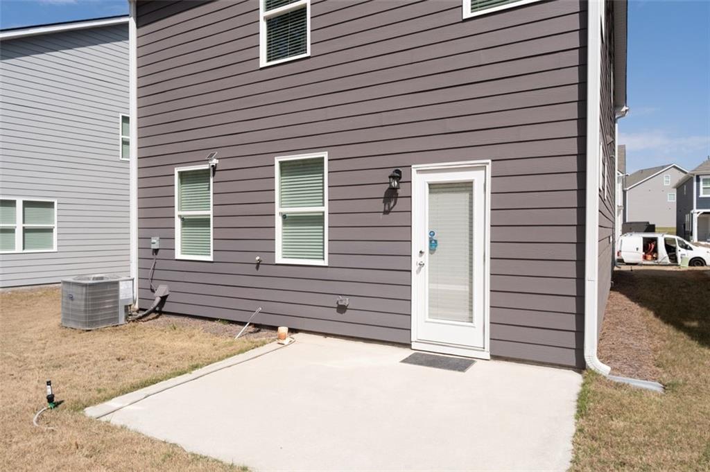 1242 Riverstone Road Jonesboro, GA 30238 - Photo 34 of 38 a view of a house with a patio