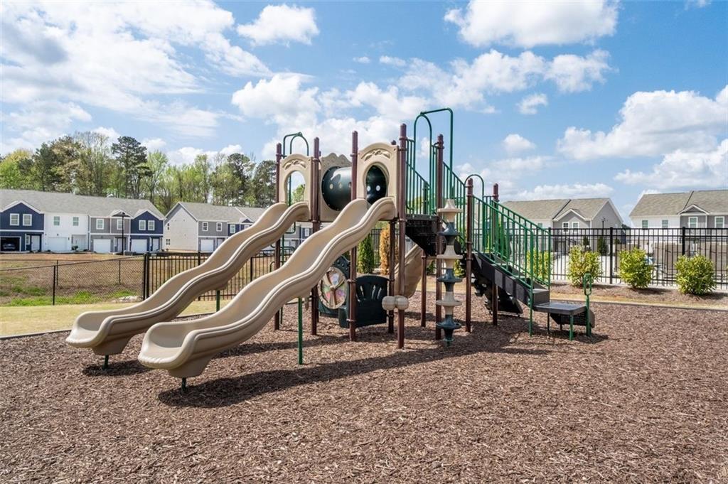 1242 Riverstone Road Jonesboro, GA 30238 - Photo 35 of 38 a view of a park with swings