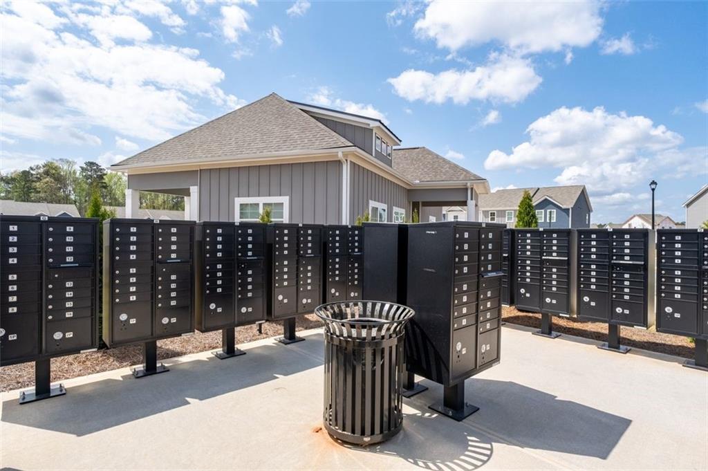 1242 Riverstone Road Jonesboro, GA 30238 - Photo 37 of 38 a front view of a house with glass top table and chair