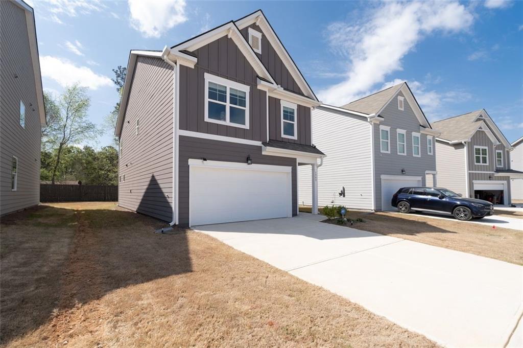 1242 Riverstone Road Jonesboro, GA 30238 - Photo 4 of 38 a view of a street with house