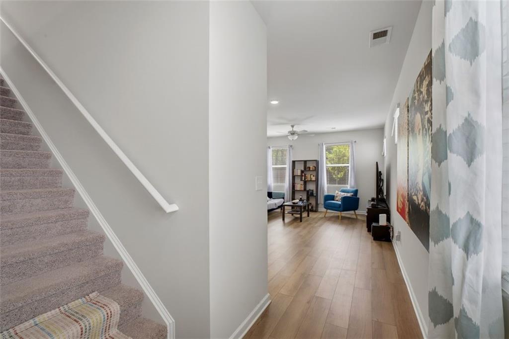 1242 Riverstone Road Jonesboro, GA 30238 - Photo 6 of 38 a view of a hallway with living room and furniture