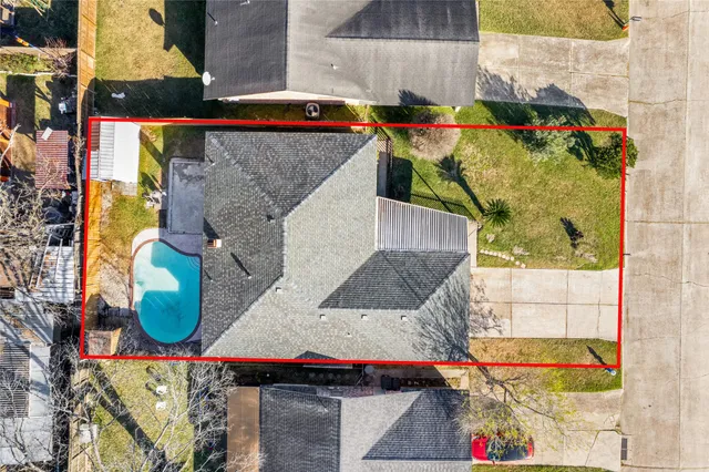 a front view of a house with a garden and yard