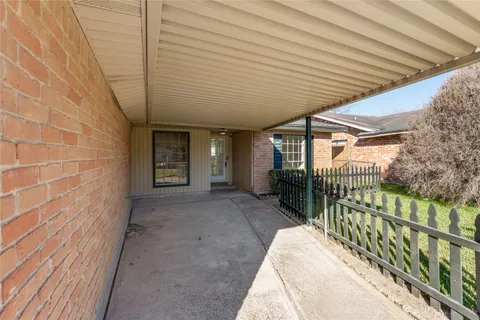 a view of a porch with wooden floor