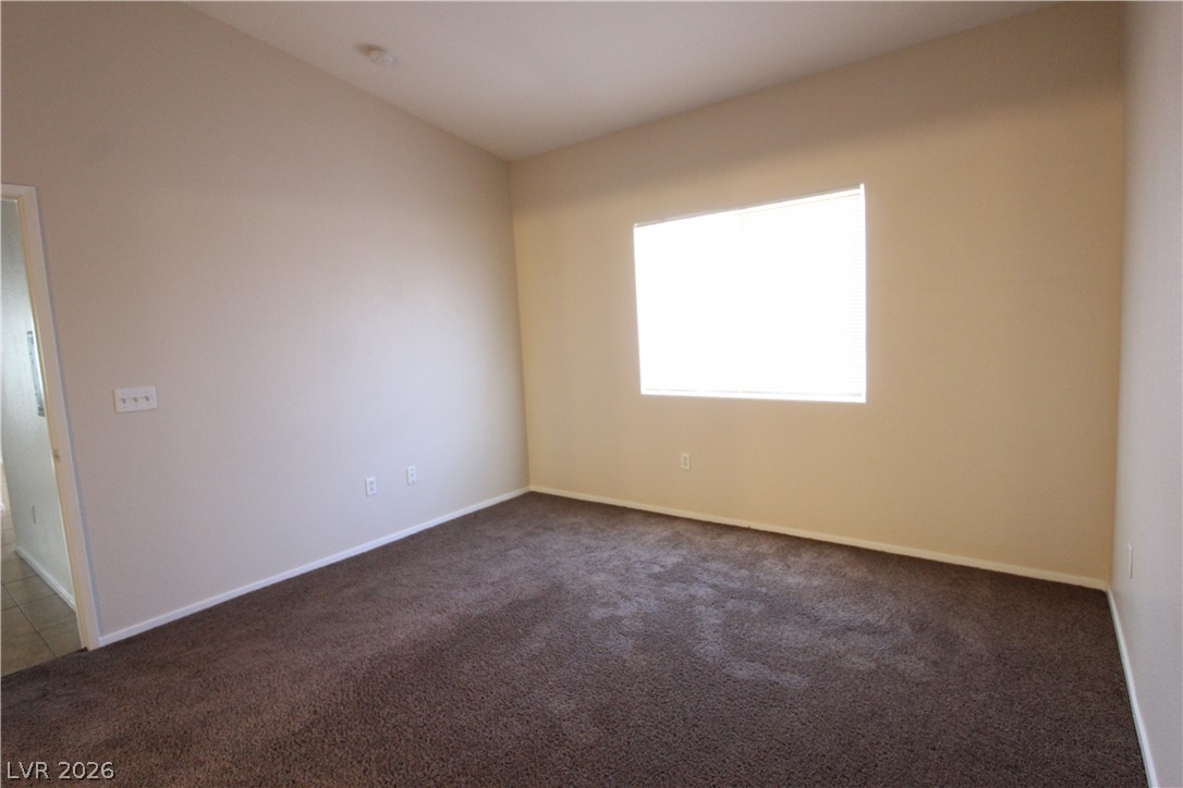 1881 West Alexander Road, Unit 2041 North Las Vegas, NV 89032 - Photo 8 of 20 LARGE PRIMARY BEDROOM