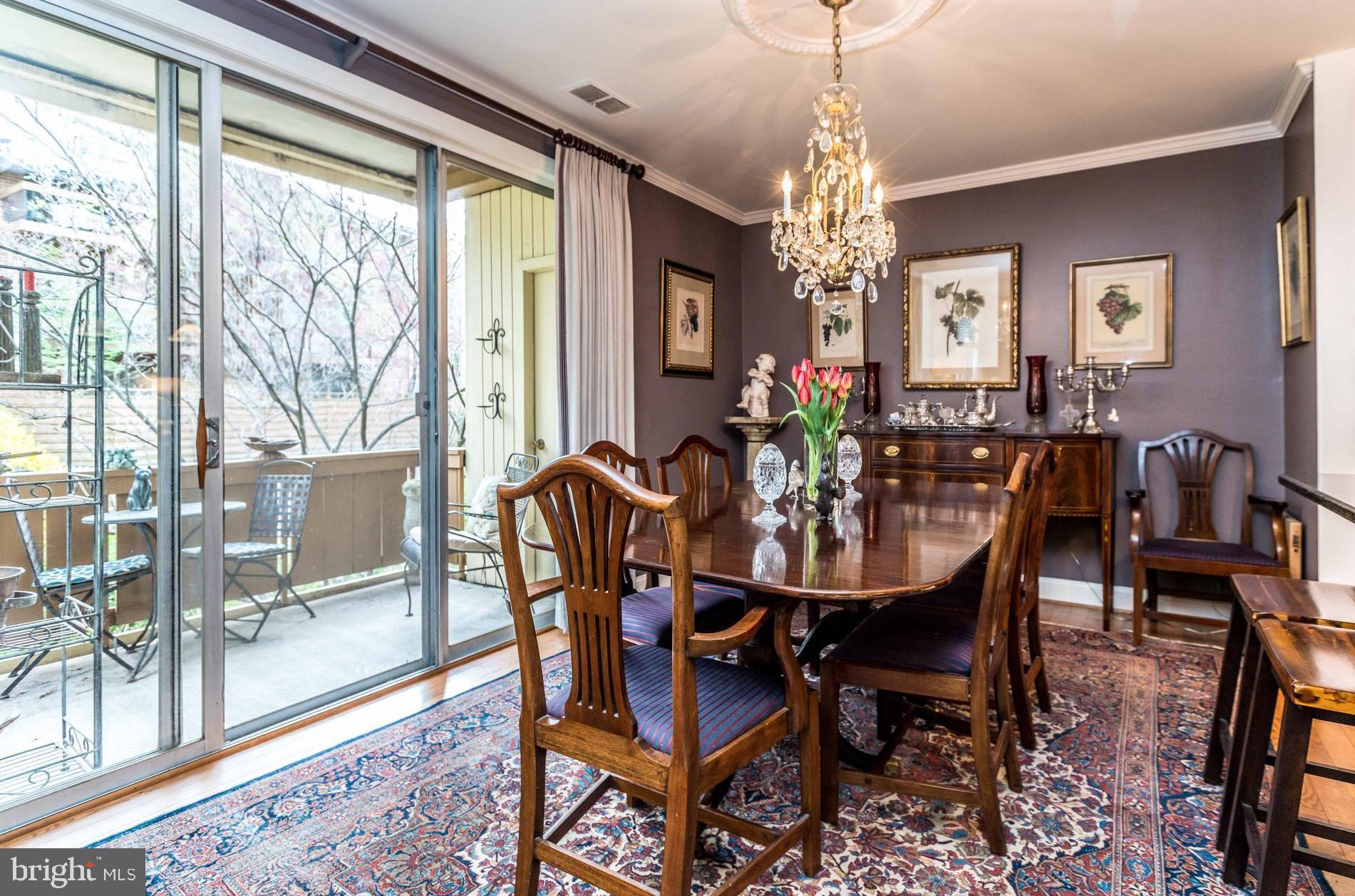 17 Hamill Road, Unit 17C Baltimore, MD 21210 - Photo 9 of 14 Dining area with sliding doors to balcony