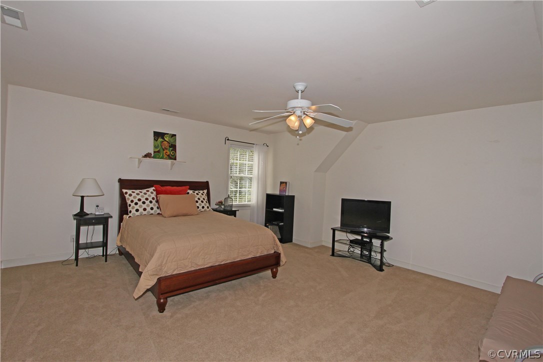 1106 Goswick Ridge Road Midlothian, VA 23114 - Photo 13 of 21 a bedroom with a bed and a lamp on table
