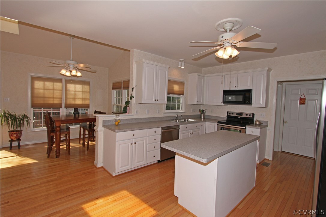 1106 Goswick Ridge Road Midlothian, VA 23114 - Photo 4 of 21 a kitchen with cabinets a sink and appliances