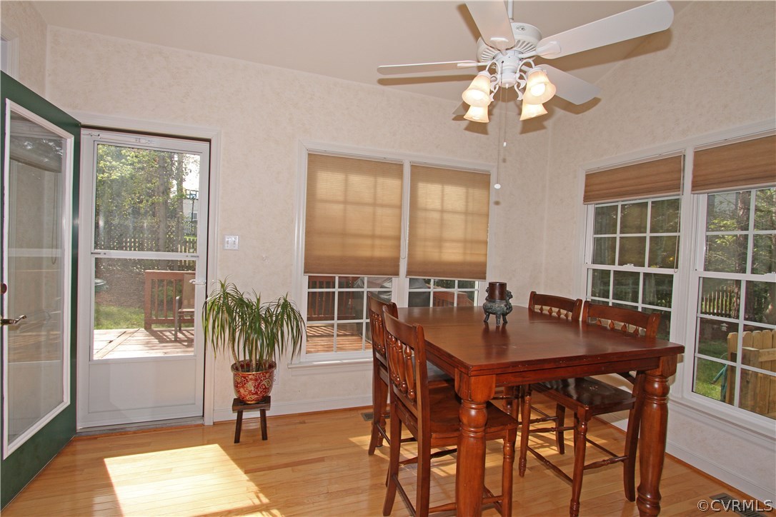 1106 Goswick Ridge Road Midlothian, VA 23114 - Photo 5 of 21 a dining room with furniture a chandelier and wooden floor