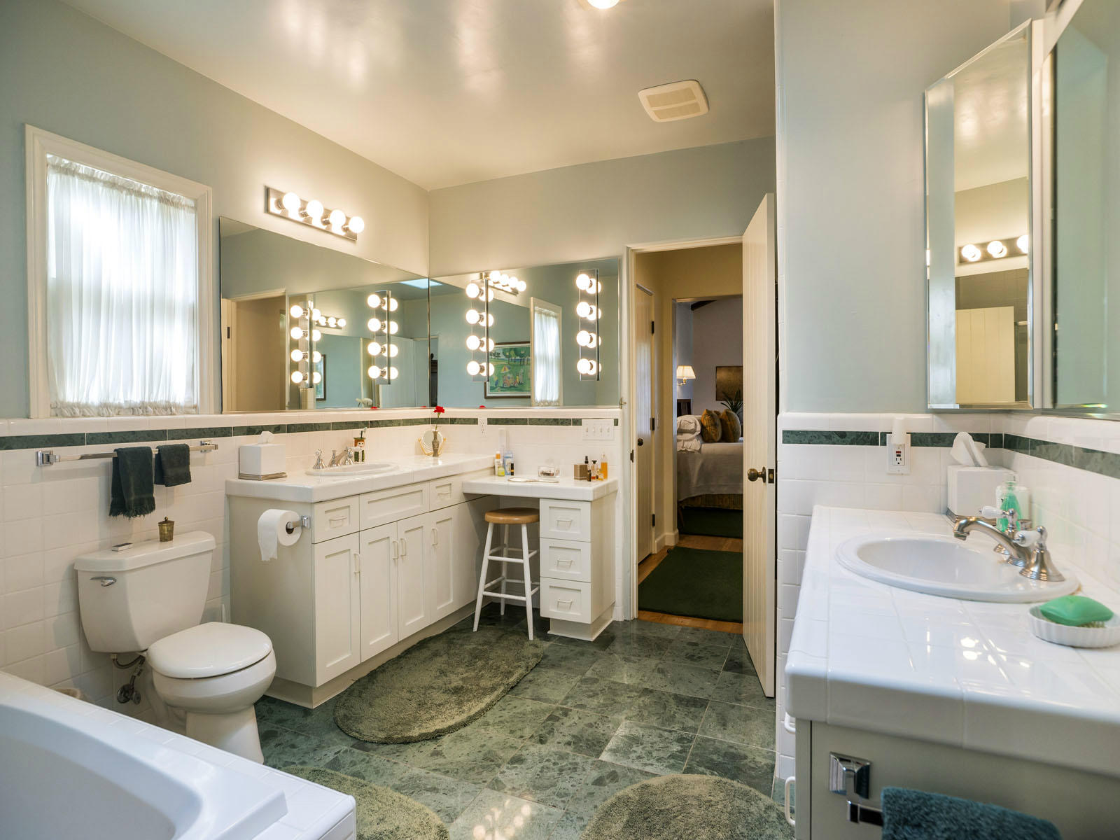 2170 East Valley Road Montecito, CA 93108 - Photo 8 of 10 a bathroom with a sink a toilet and mirror