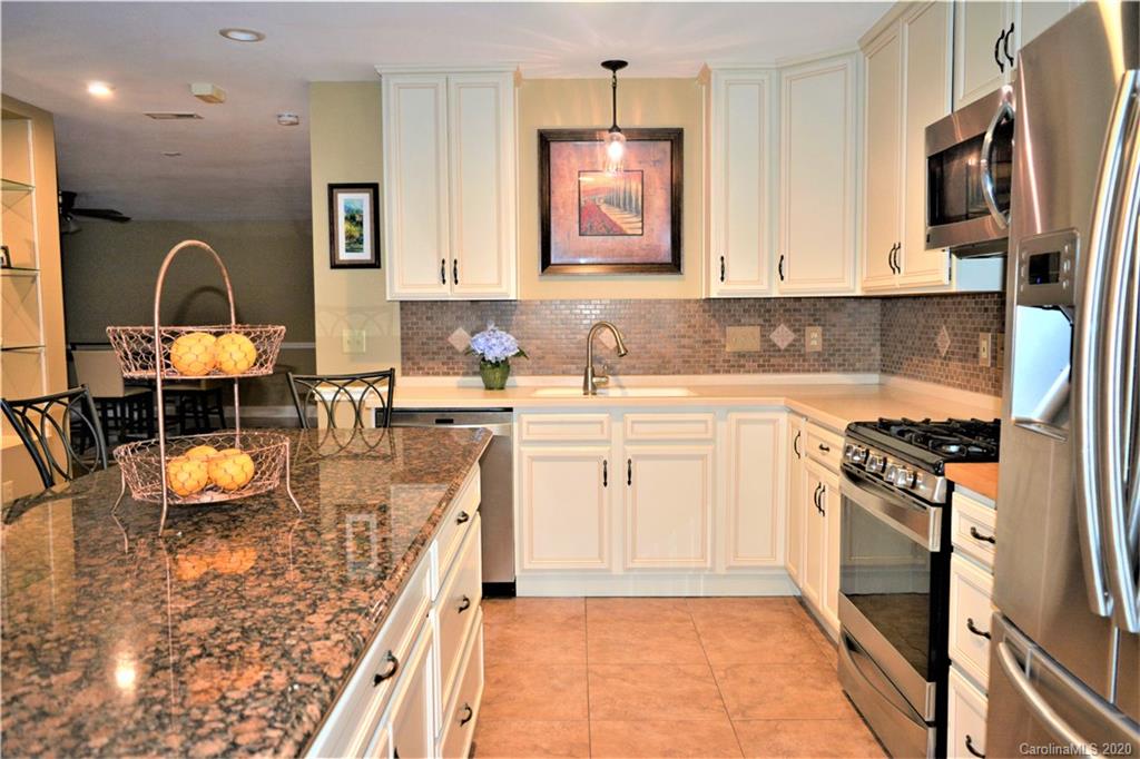 121 Spring Branch Road Fort Mill, SC 29715 - Photo 15 of 17 a kitchen with a sink appliances and cabinets