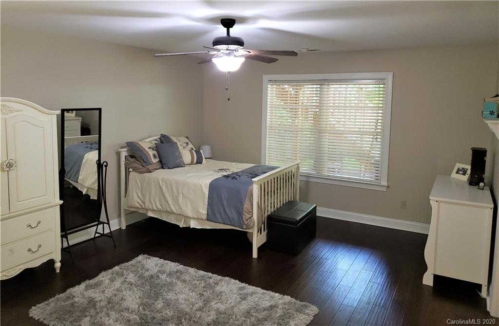 121 Spring Branch Road Fort Mill, SC 29715 - Photo 17 of 17 a bedroom with a bed and a chair