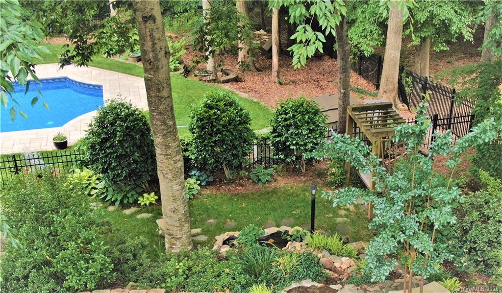 121 Spring Branch Road Fort Mill, SC 29715 - Photo 4 of 17 a view of a garden with a bench