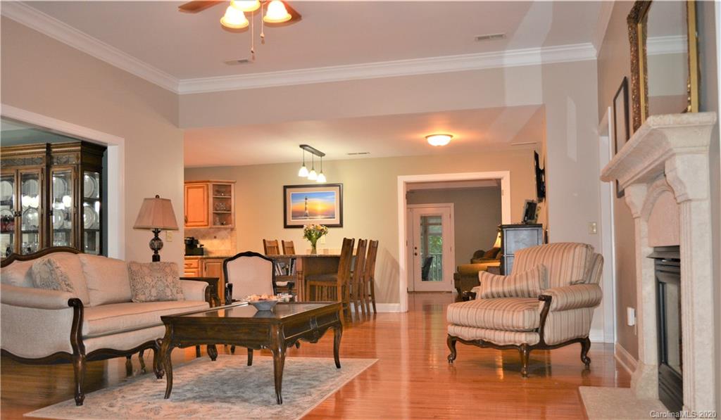 121 Spring Branch Road Fort Mill, SC 29715 - Photo 7 of 17 a living room with fireplace furniture and a chandelier