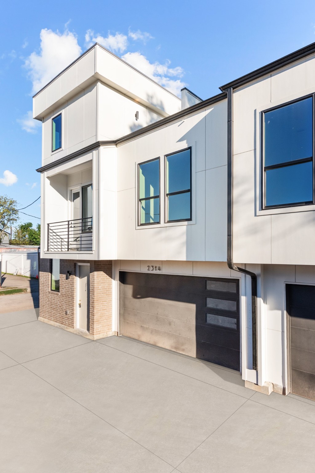 a front view of a house with large windows