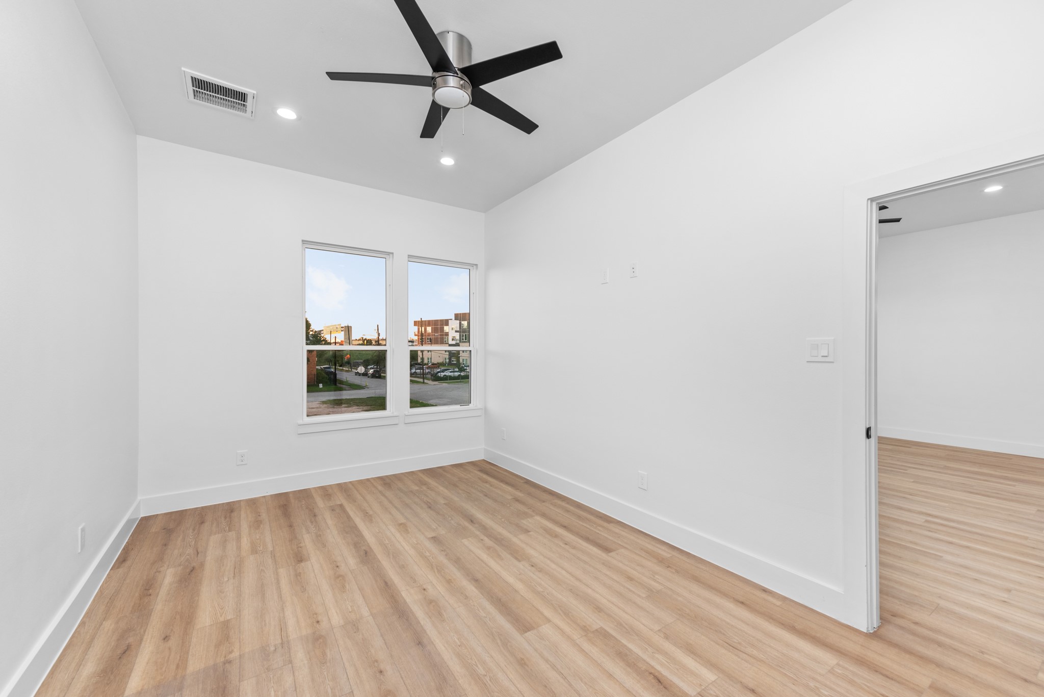 2314 Barbee Street Houston, TX 77004 - Photo 15 of 15 wooden floor in an empty room with a window