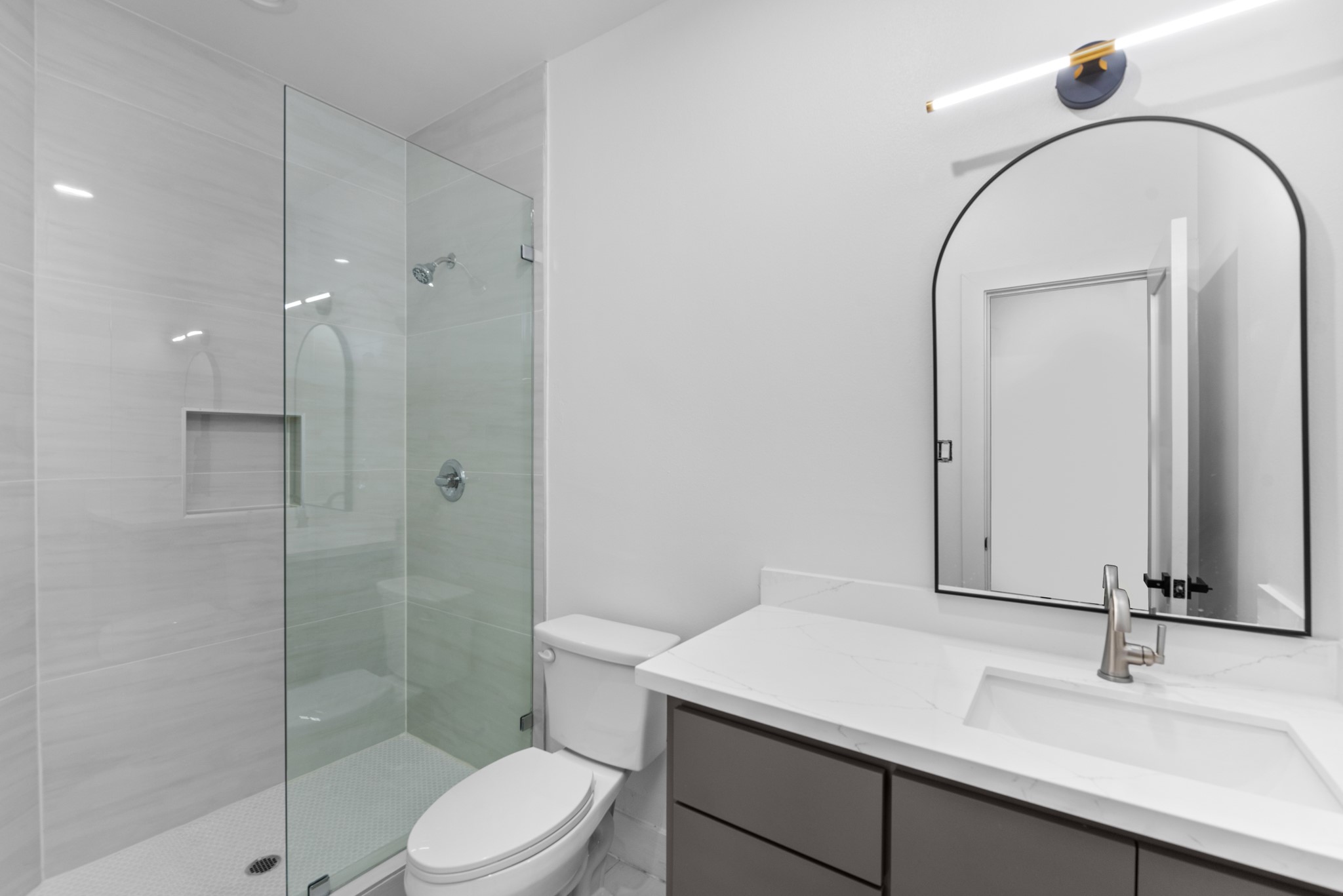 2314 Barbee Street Houston, TX 77004 - Photo 3 of 15 a bathroom with a sink a toilet and shower