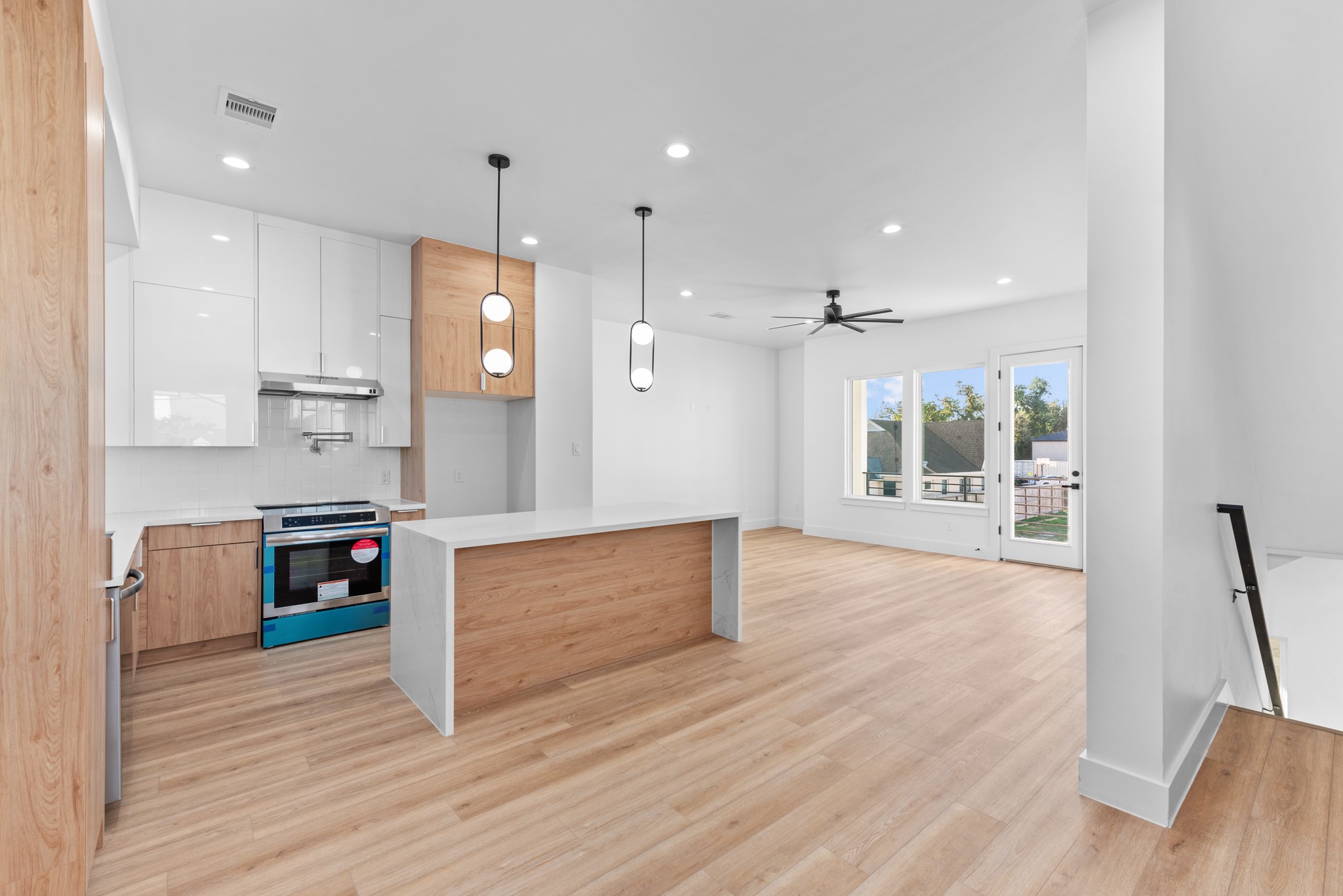 2314 Barbee Street Houston, TX 77004 - Photo 4 of 15 a large kitchen with stainless steel appliances granite countertop a large window and a refrigerator