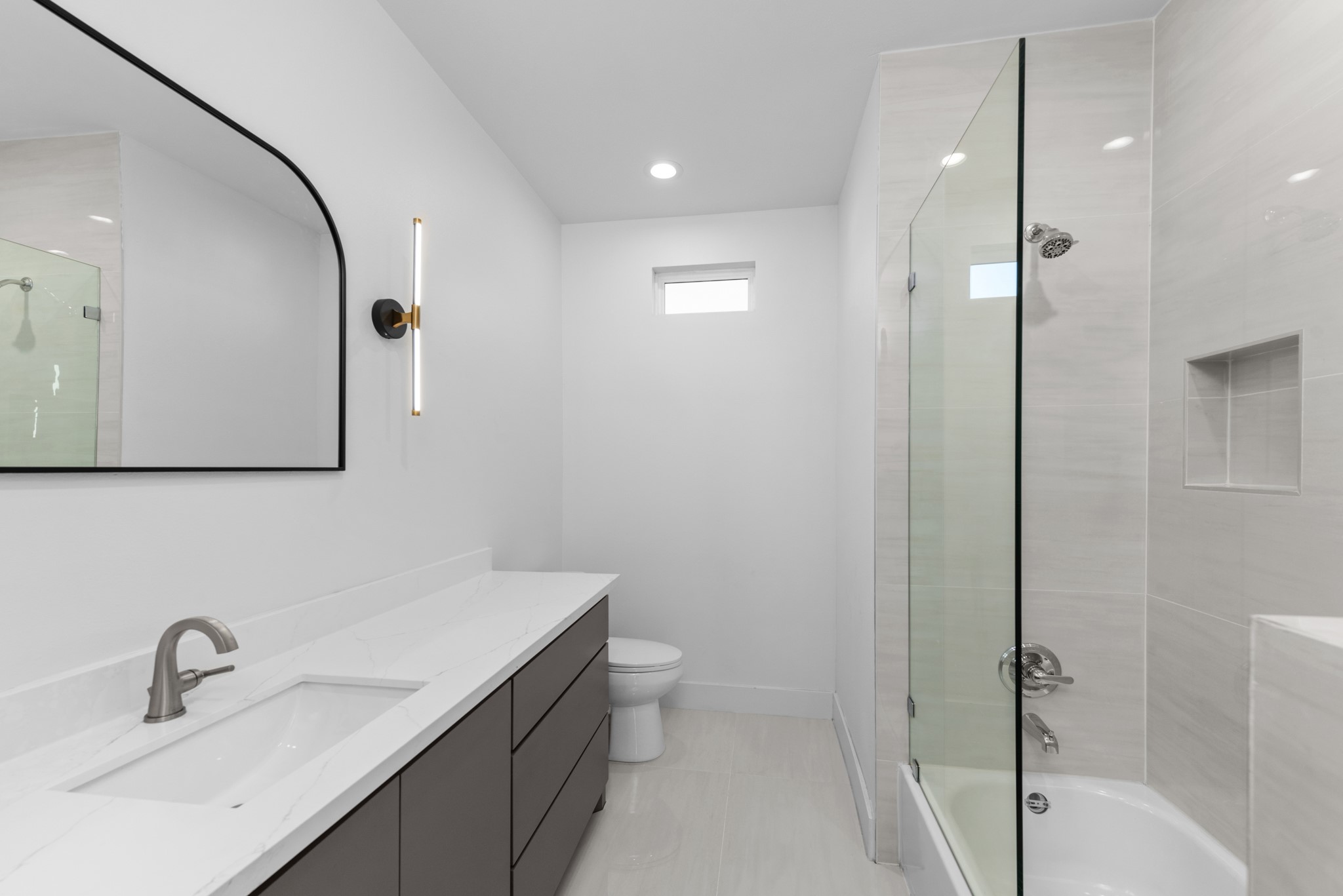 2314 Barbee Street Houston, TX 77004 - Photo 5 of 15 a bathroom with a sink and mirror with toilet