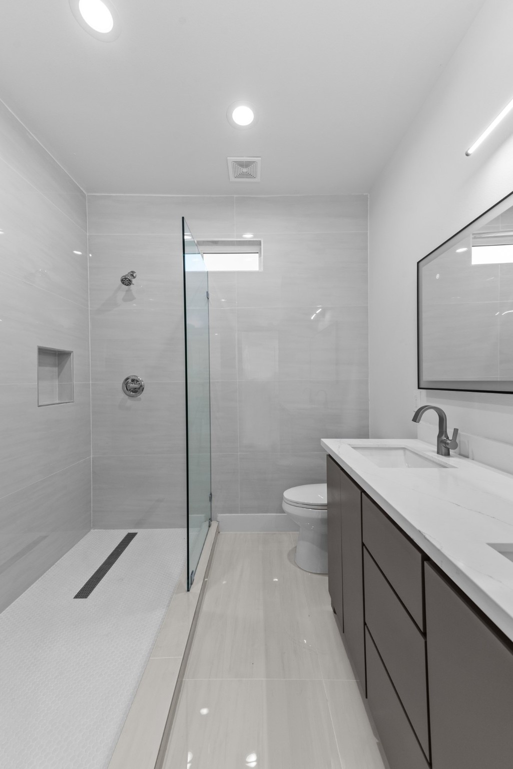 2314 Barbee Street Houston, TX 77004 - Photo 8 of 15 a bathroom with a sink a toilet and shower