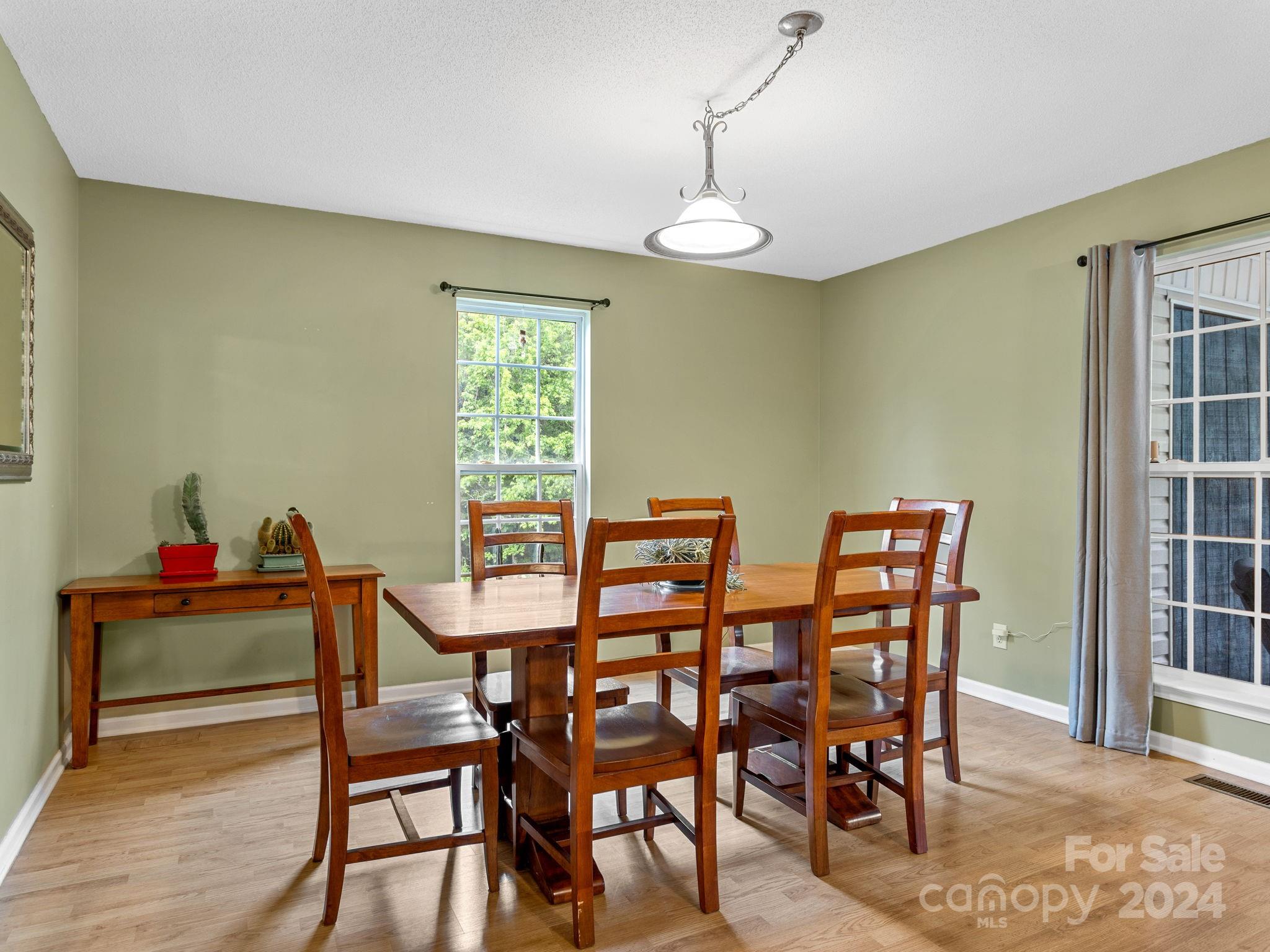 1020 Smith Road Columbus, NC 28722 - Photo 13 of 40 a view of a dining room with furniture and a window
