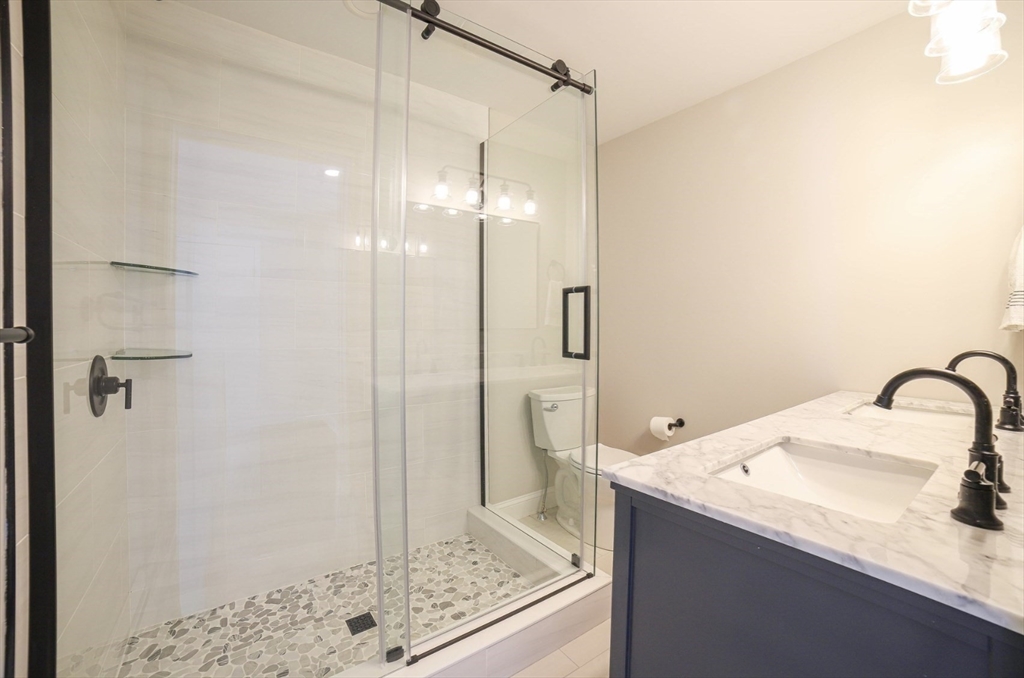 3 Woods Road Westminster, MA 01473 - Photo 13 of 41 a bathroom with a granite countertop sink a shower and mirror