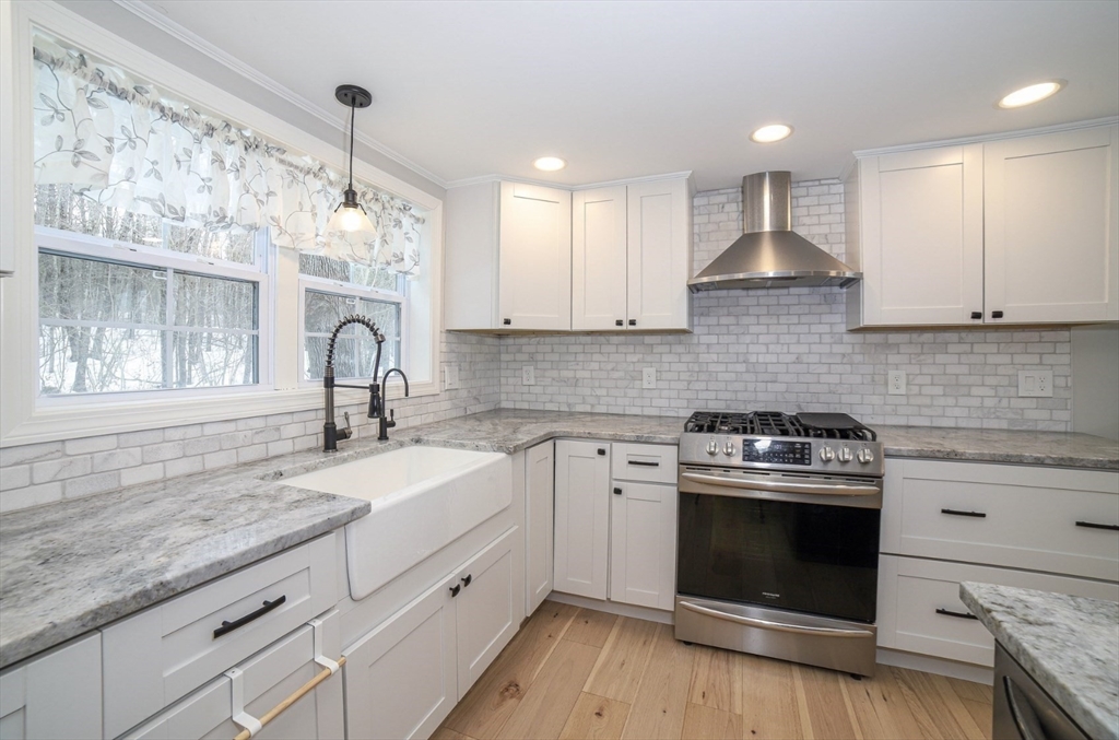 3 Woods Road Westminster, MA 01473 - Photo 2 of 41 a kitchen with a stove and a sink