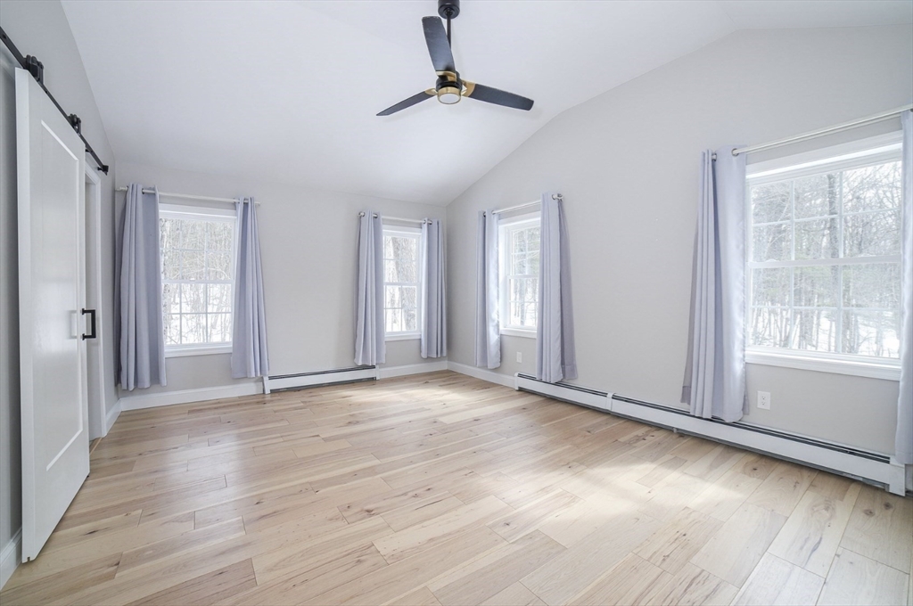 3 Woods Road Westminster, MA 01473 - Photo 29 of 41 a view of an empty room with window and wooden floor