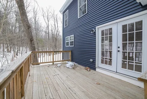 a balcony view with a hardwood floor
