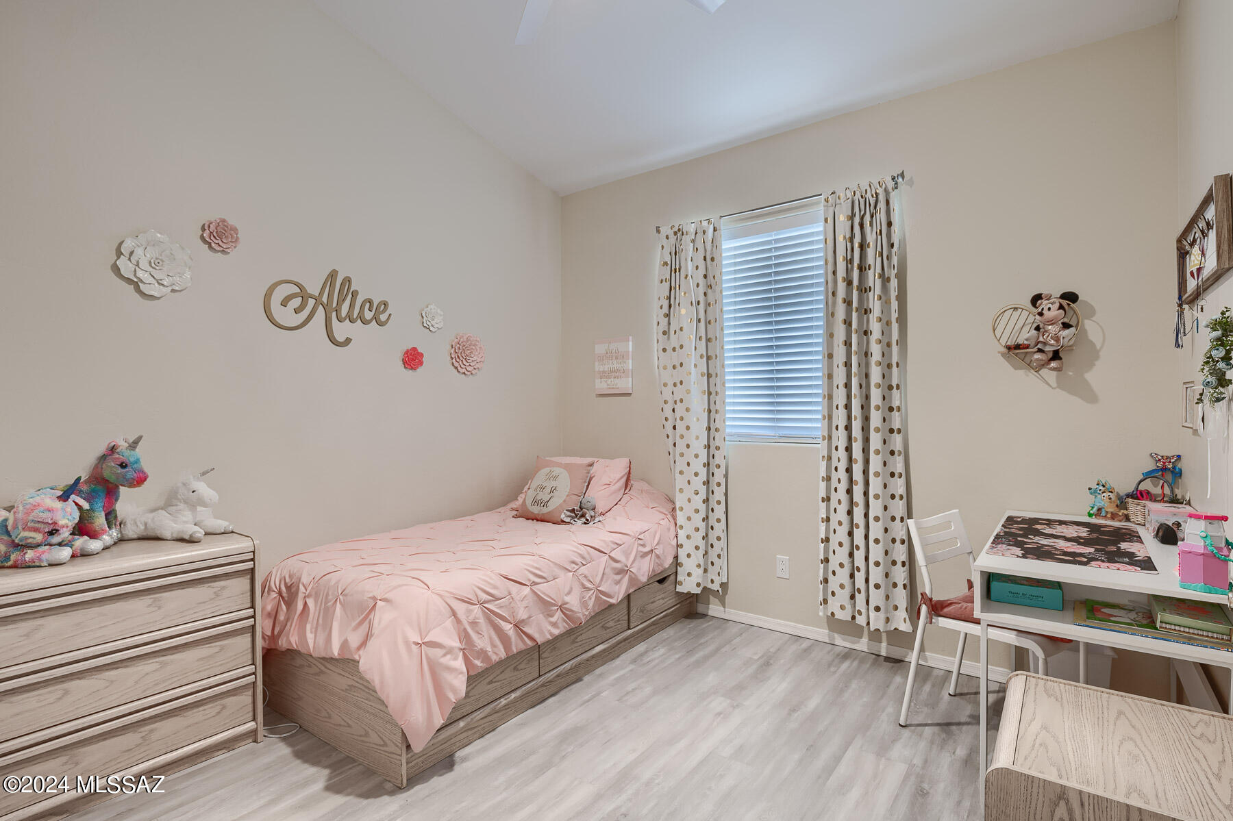 9141 East Dawn Post Road Tucson, AZ 85749 - Photo 16 of 24 a bedroom with a bed and wooden floor