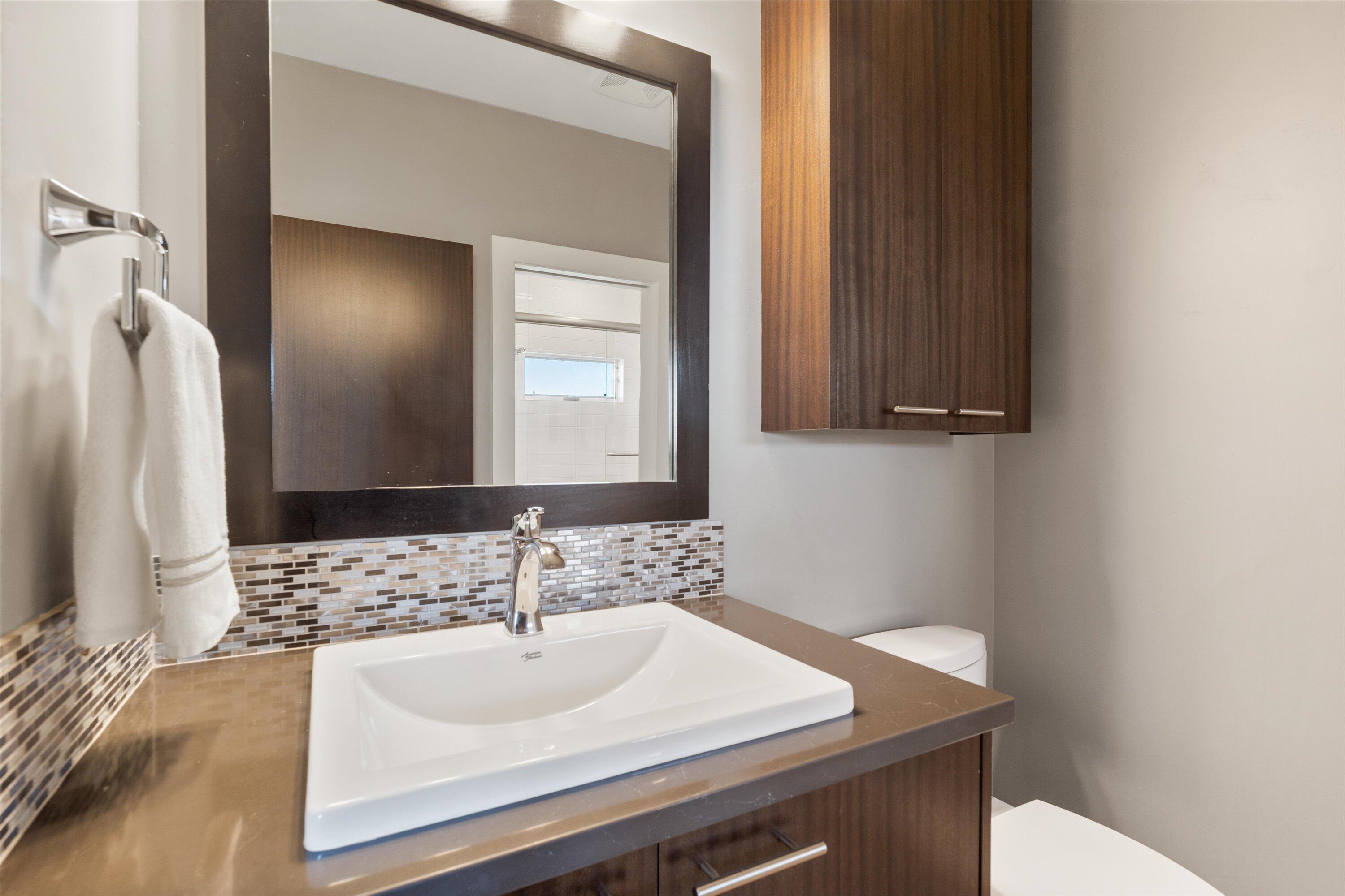 16389 South W Brasada Ranch Road Powell Butte, OR 97753 - Photo 35 of 63 a bathroom with a sink and a mirror