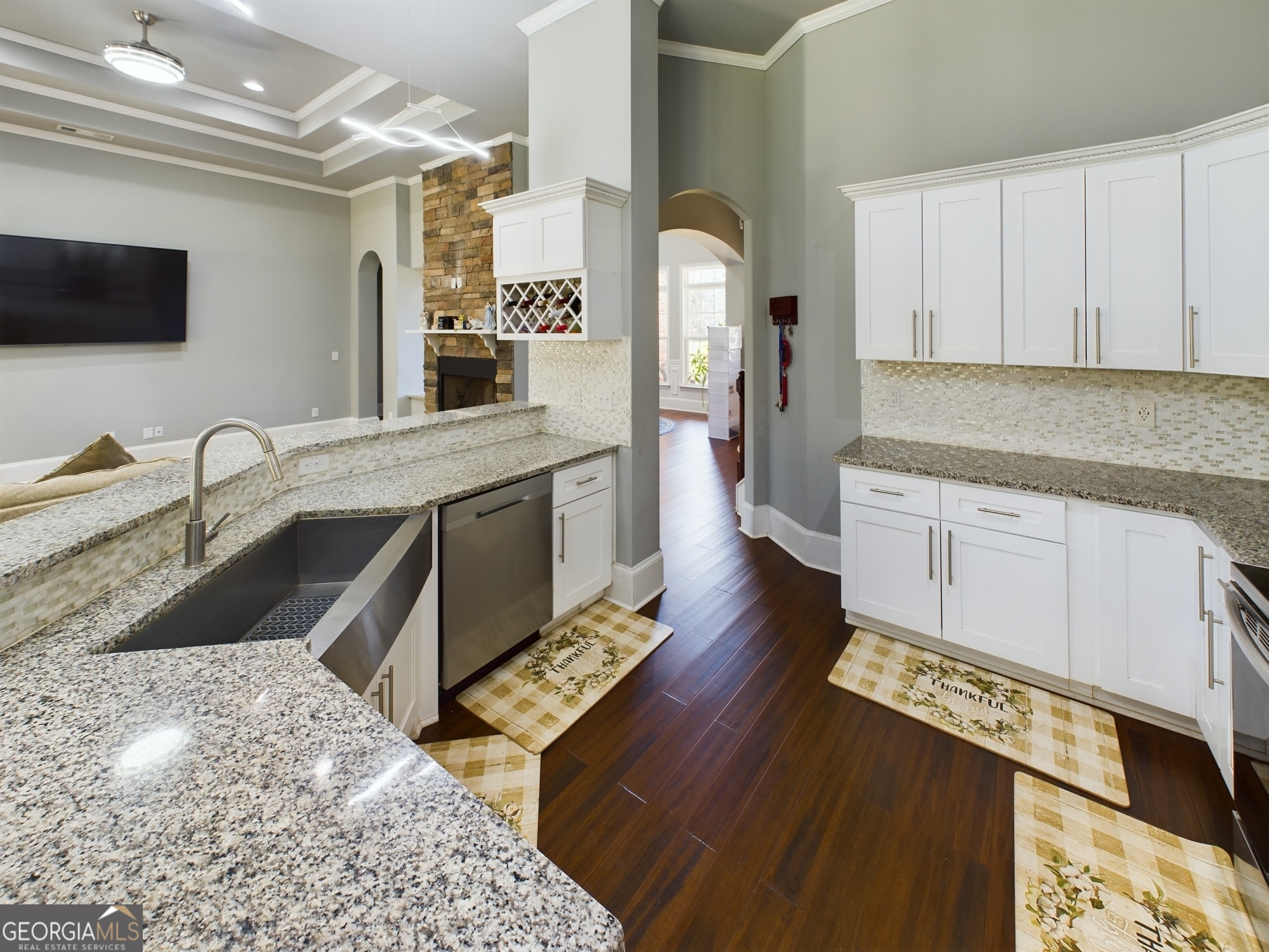4305 High Falls Road Griffin, GA 30224 - Photo 12 of 33 a kitchen with stainless steel appliances granite countertop a sink stove and cabinets
