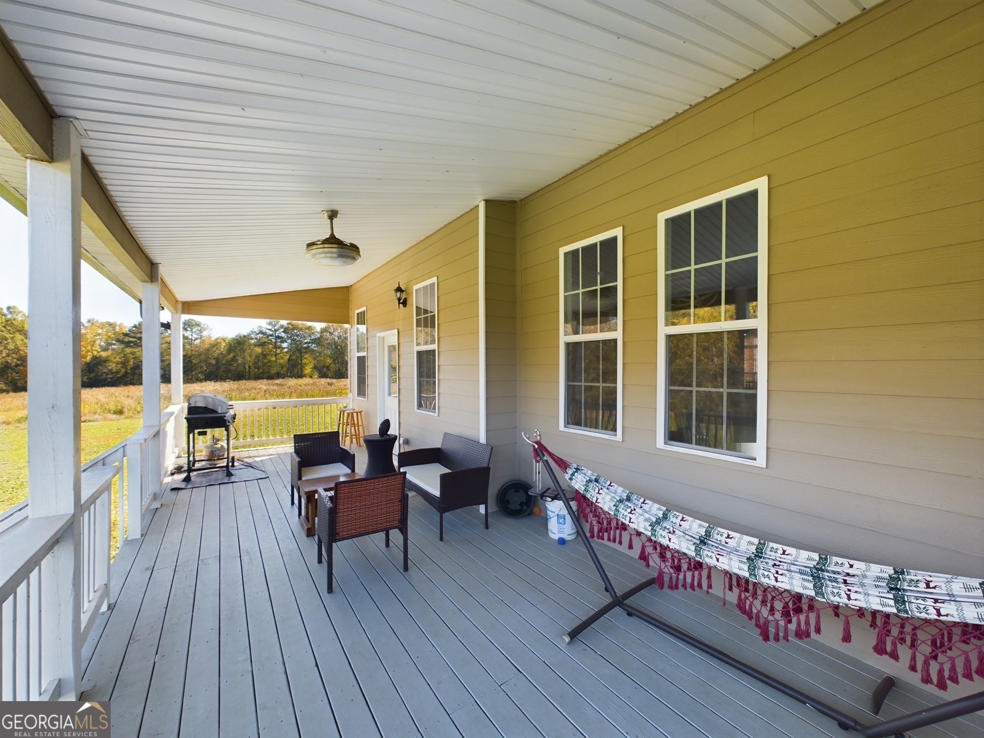 4305 High Falls Road Griffin, GA 30224 - Photo 24 of 33 a view of a living room and wooden deck