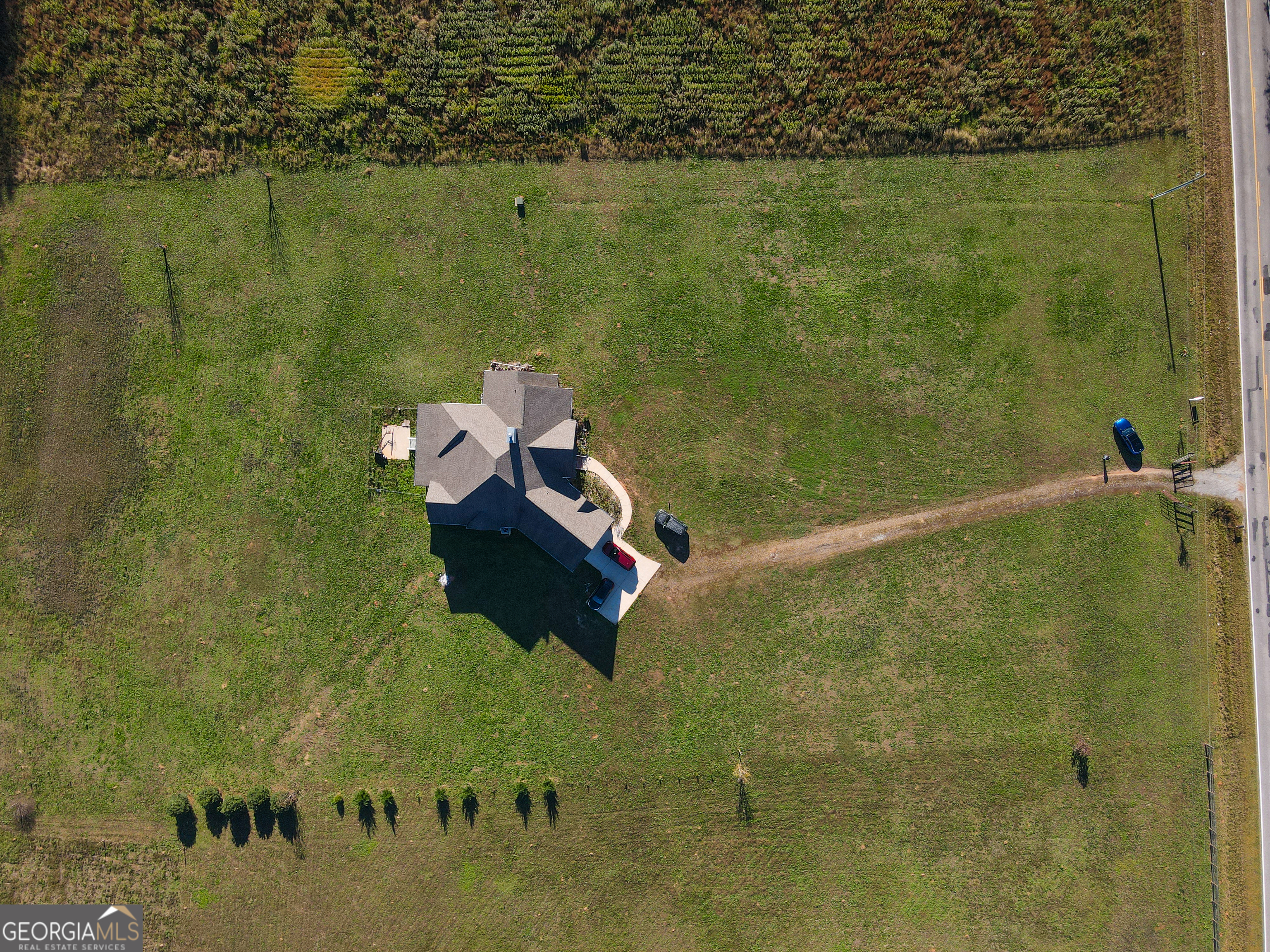 4305 High Falls Road Griffin, GA 30224 - Photo 31 of 33 a aerial view of a house with a lake view