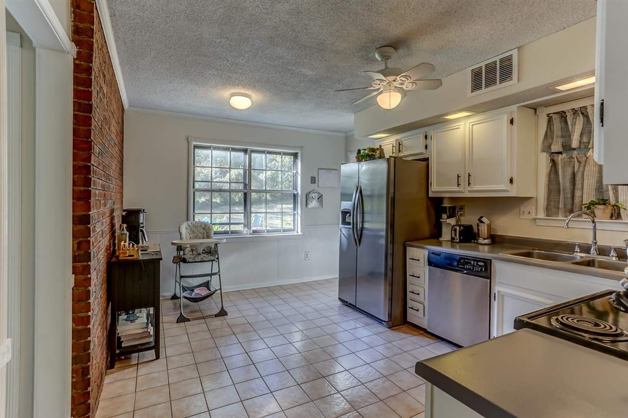 381 Rutledge Street Collierville, TN 38017 - Photo 11 of 23 a kitchen with stainless steel appliances granite countertop a refrigerator and a sink