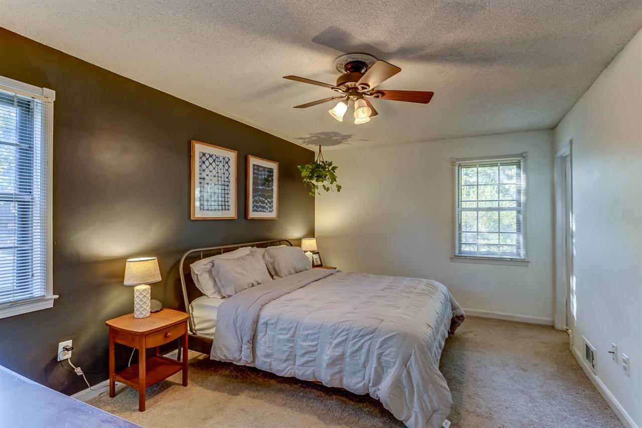 381 Rutledge Street Collierville, TN 38017 - Photo 14 of 23 a bedroom with a bed and a chandelier