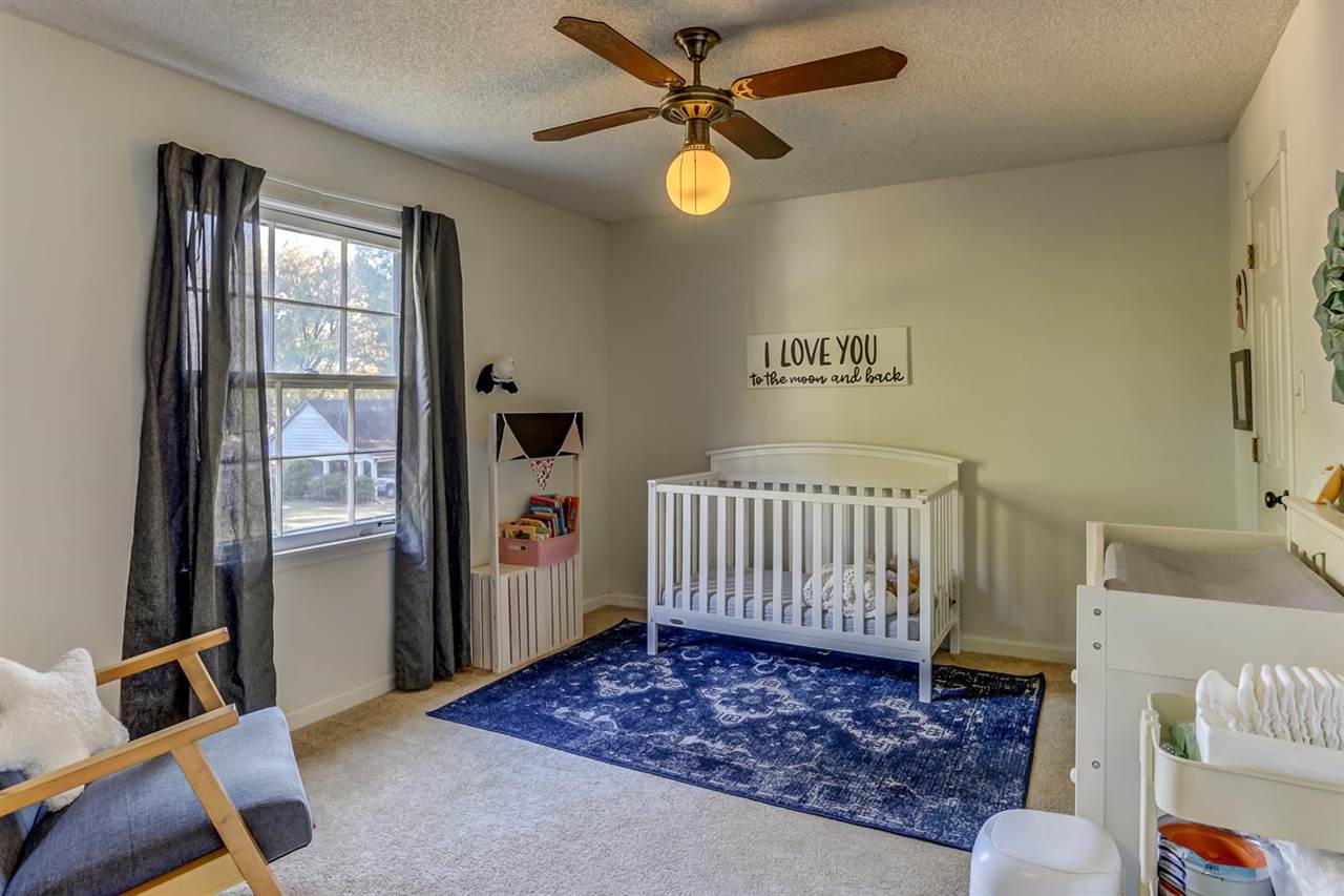 381 Rutledge Street Collierville, TN 38017 - Photo 17 of 23 a bedroom with a bed and a window