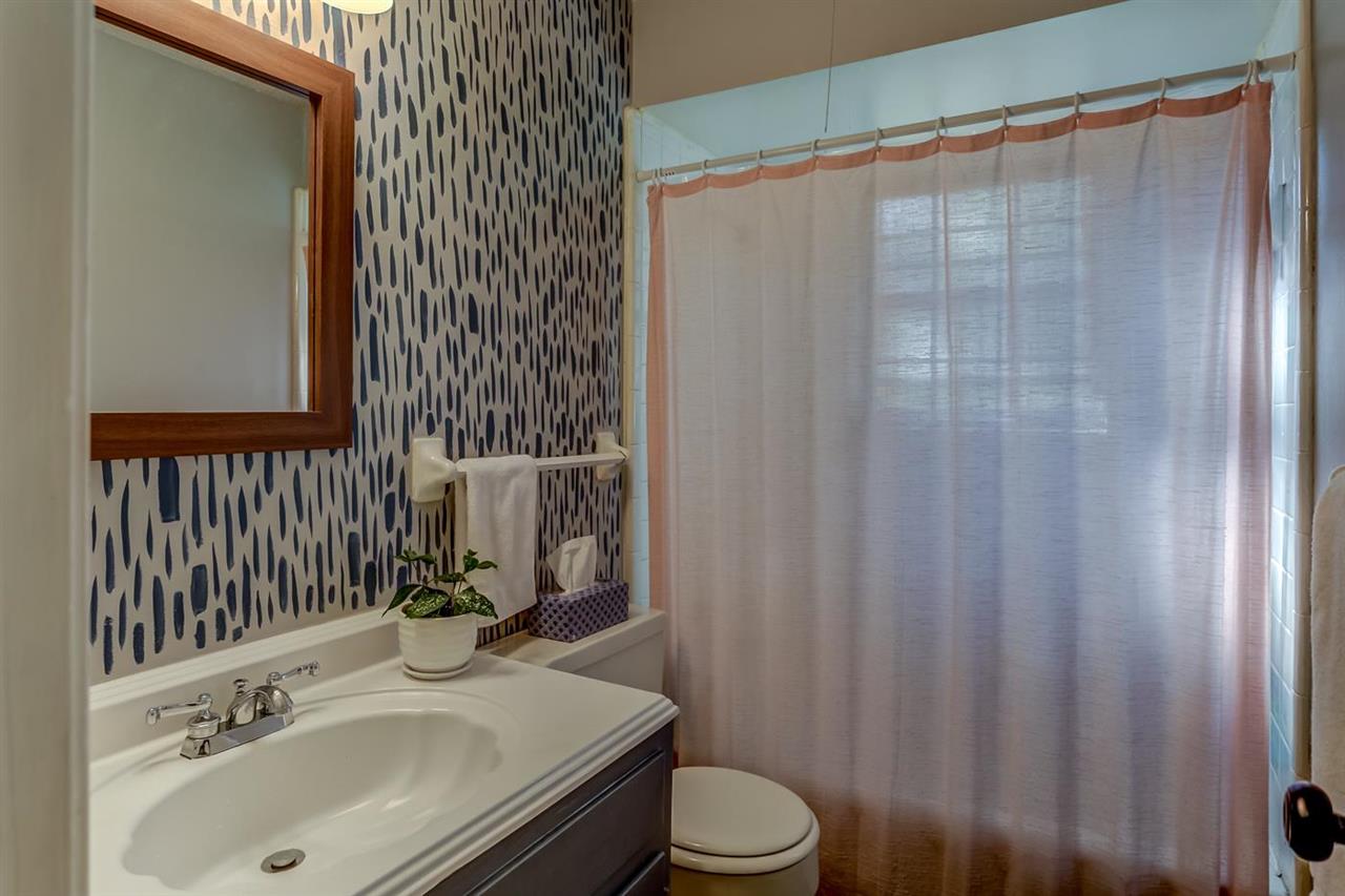 381 Rutledge Street Collierville, TN 38017 - Photo 20 of 23 a bathroom with a sink a toilet and shower curtain