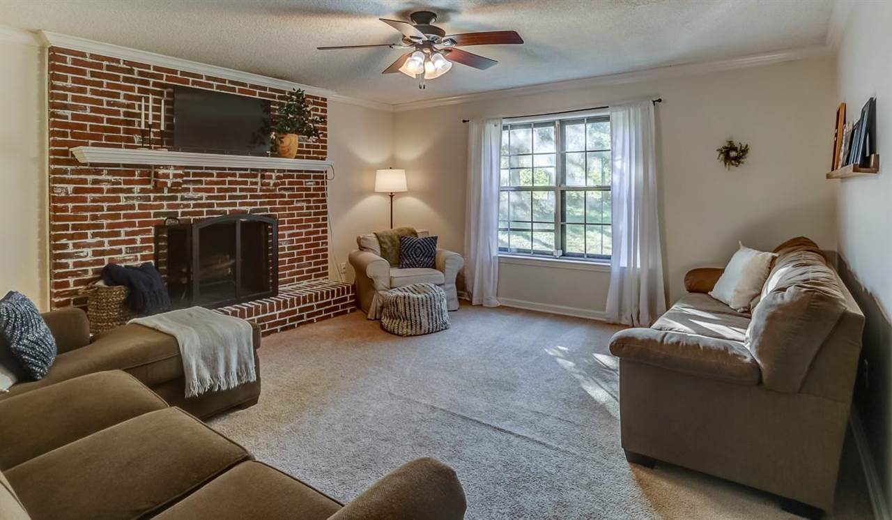 381 Rutledge Street Collierville, TN 38017 - Photo 7 of 23 a living room with furniture and a fireplace