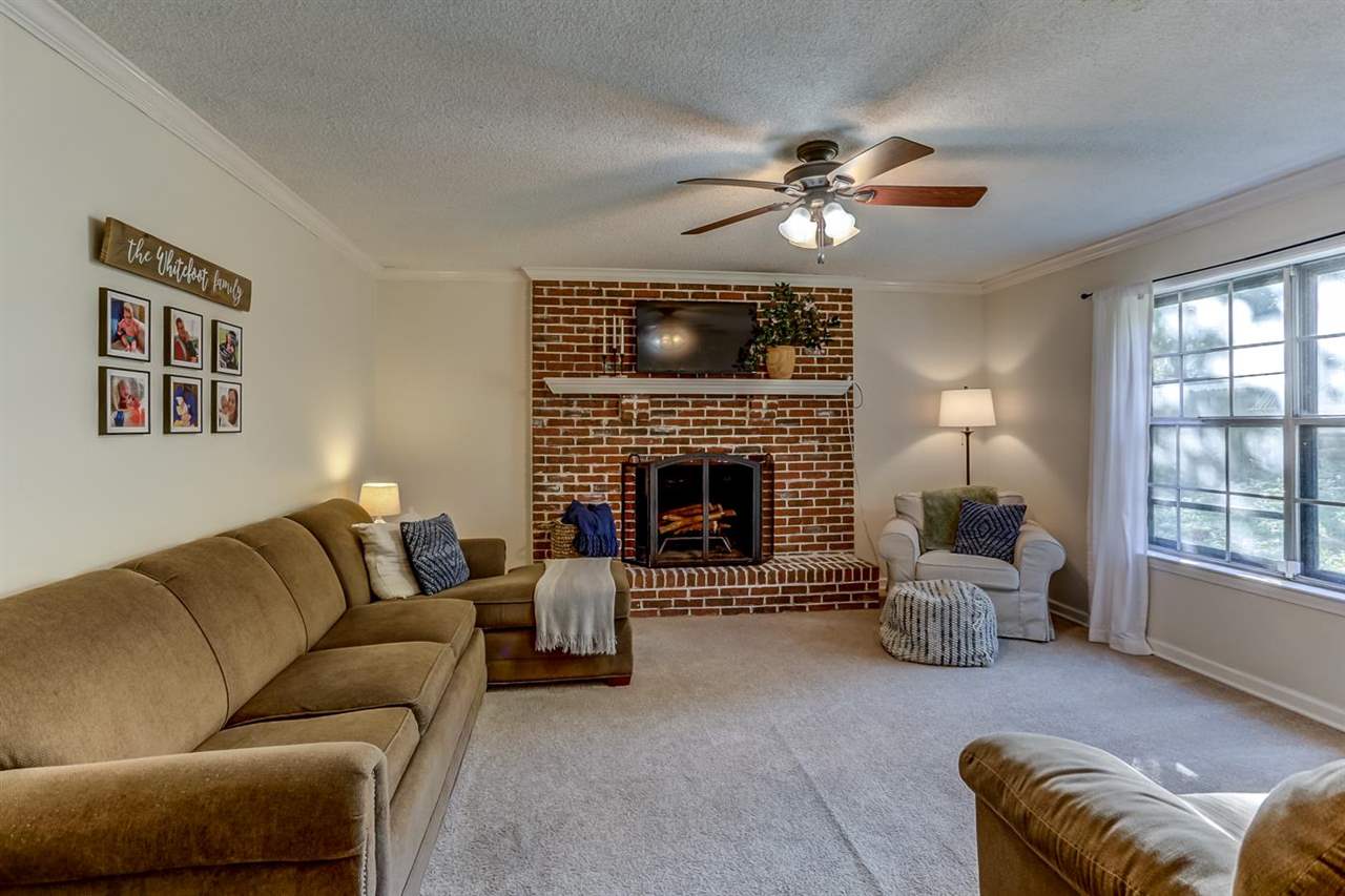 381 Rutledge Street Collierville, TN 38017 - Photo 8 of 23 a living room with furniture and a fireplace