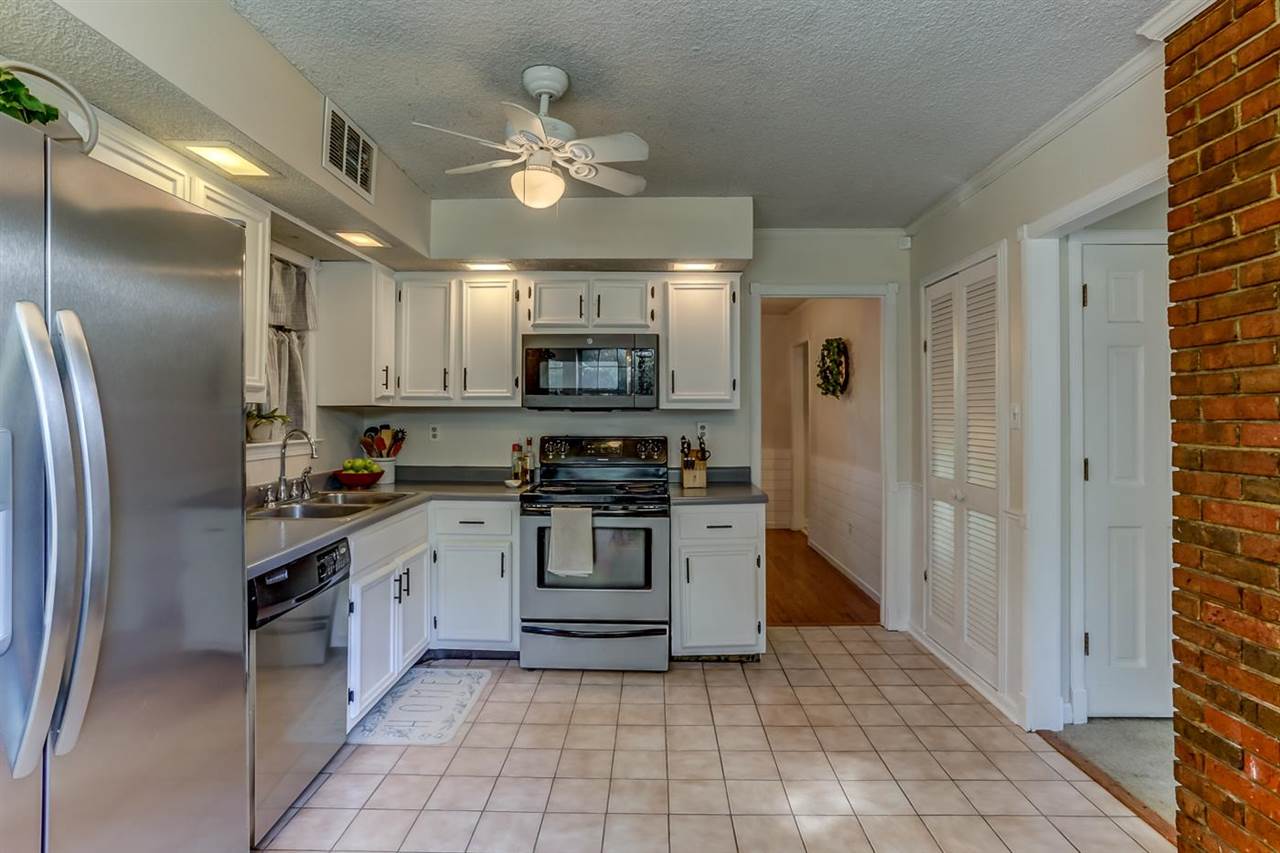 381 Rutledge Street Collierville, TN 38017 - Photo 9 of 23 a kitchen with stainless steel appliances granite countertop a refrigerator and a stove top oven