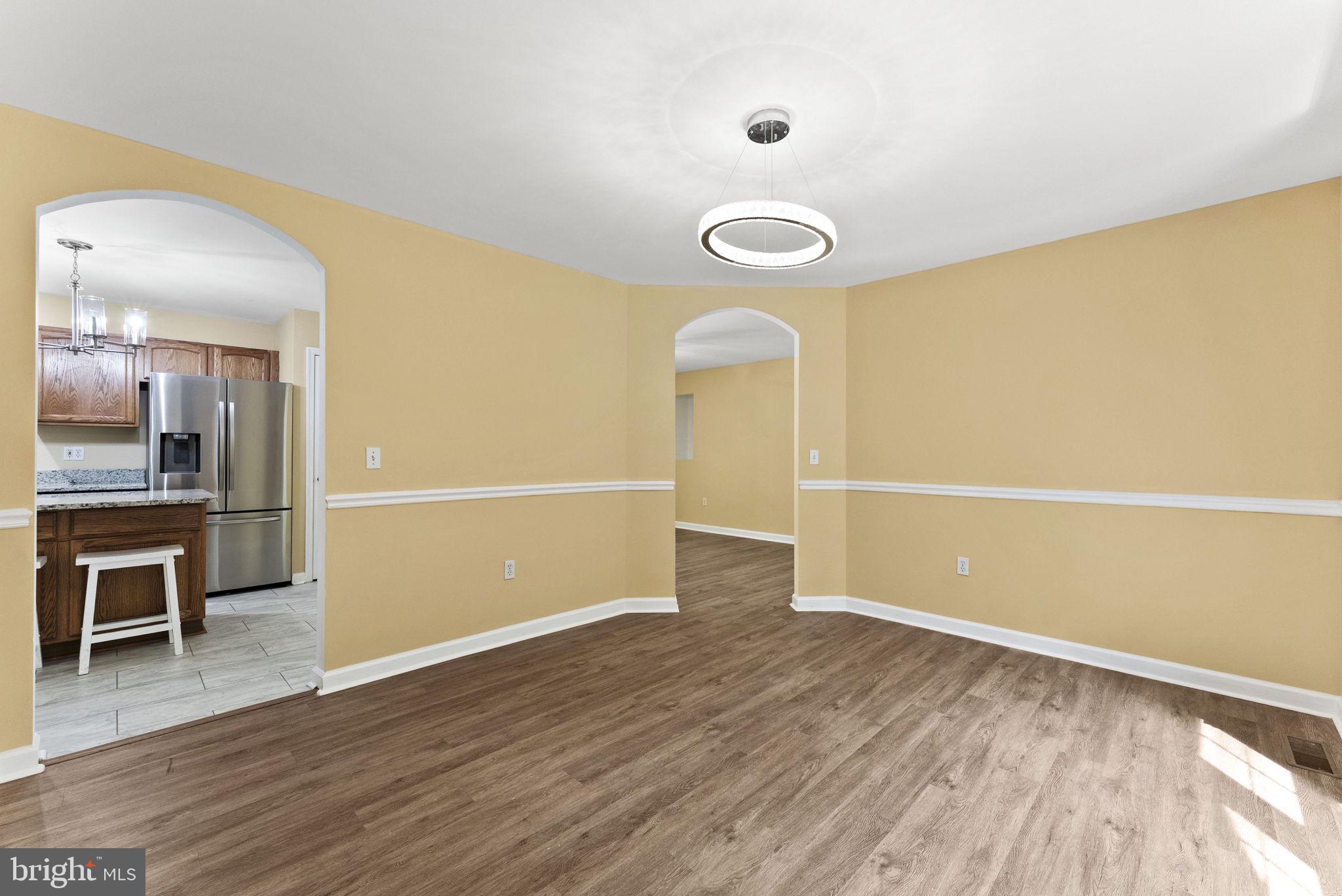 20065 Crooked Run Road Culpeper, VA 22701 - Photo 13 of 62 an empty room with wooden floor and windows