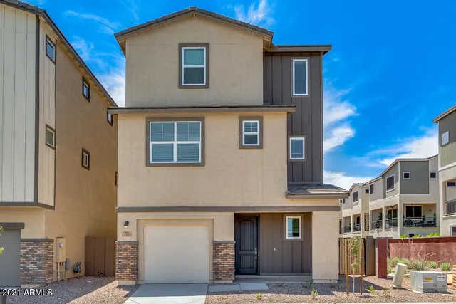 a front view of a house with a garage